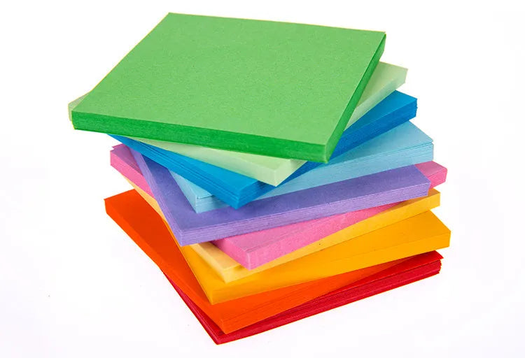 Assorted colour mini paper scrolls with punched holes for drift bottle notes and crafts.