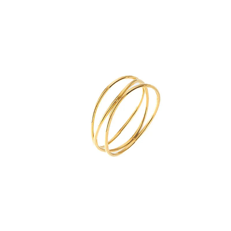 Gold geometric line ring with three-layer coil design on finger