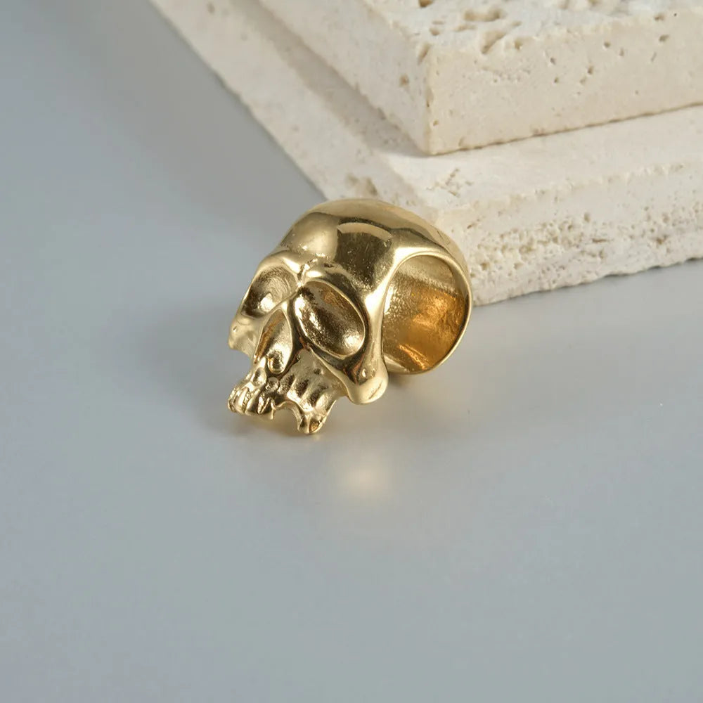 Stainless steel hollow geometric skull Buddha earrings for auricle piercing in electroplated colours