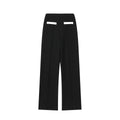Women's beaded leather round neck top and high-waisted trousers suit in a casual street style.
