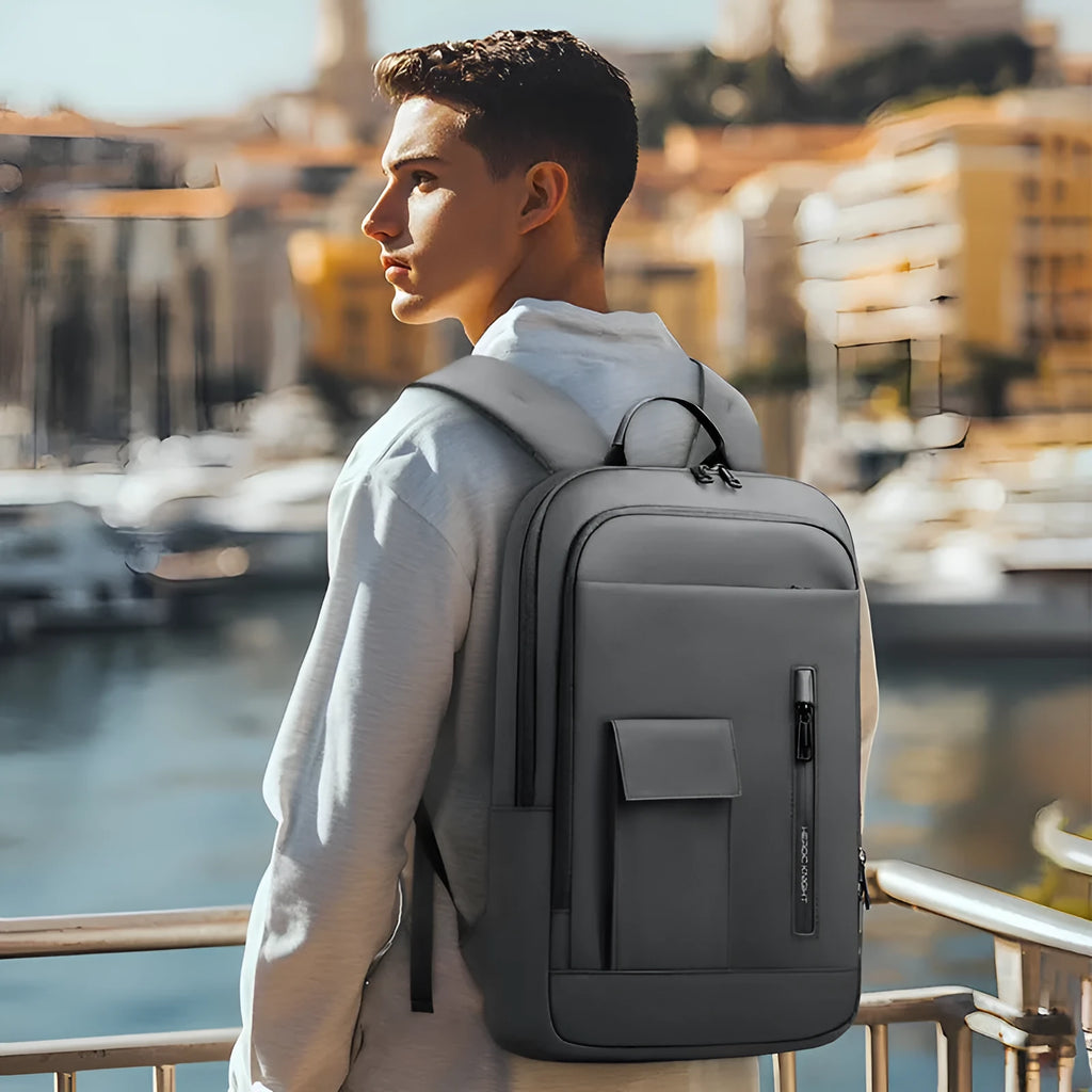 Lightweight Oxford cloth men's backpack in solid colour with sewing line detail.