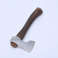 Camping axe with high carbon steel blade and wooden handle on a neutral background.
