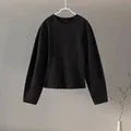 Women's black polar fleece suit set with O-neck top and wide leg trousers