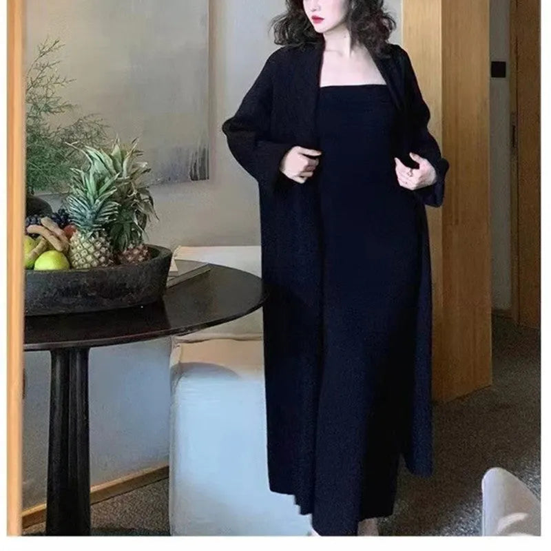 Women's grey knitted cardigan dress suit with matching coat, showing flocked pattern detail.