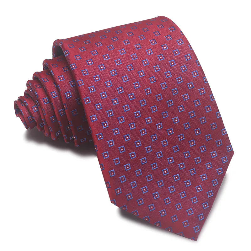 Close-up of a red, black, and blue striped men's formal tie with a textured Jacquard weave.