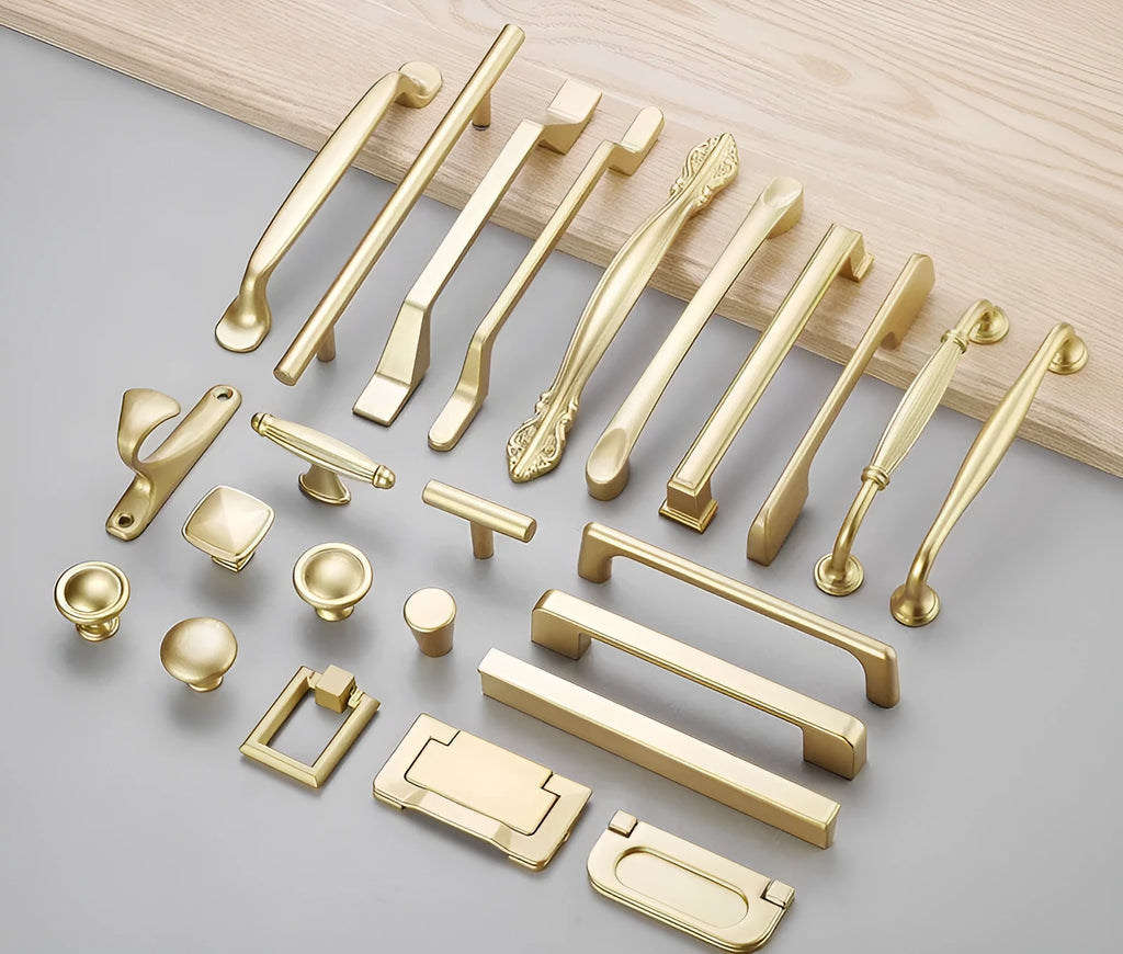 Gold aluminium alloy single-hole T-shape cabinet drawer handle on white background.