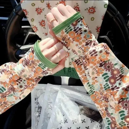 A pair of printed viscose ice silk sun protection sleeve gloves covering the forearm and elbow.