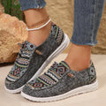 Women's black slip-on flat shoes with round toe and artificial PU upper