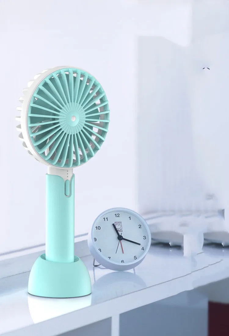 Blue handheld mini silent desktop electric fan with USB cable, three-speed control, and shaking head function.