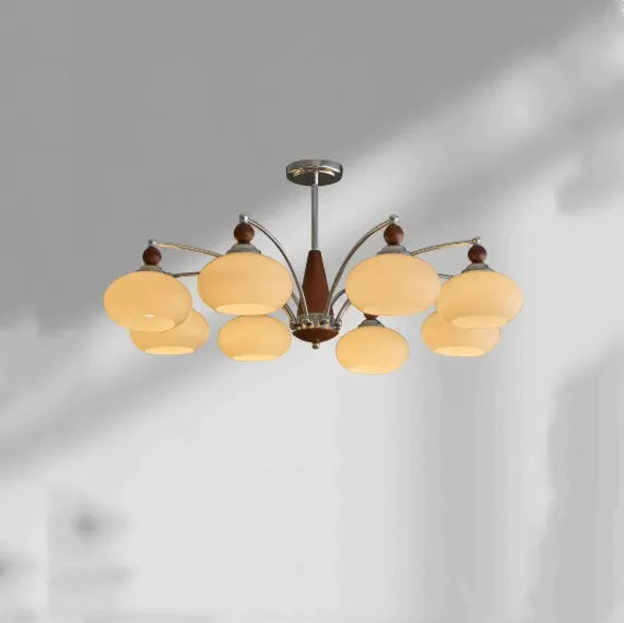 Traditional persimmon glass and chrome chandelier with multiple light heads for a dining room.