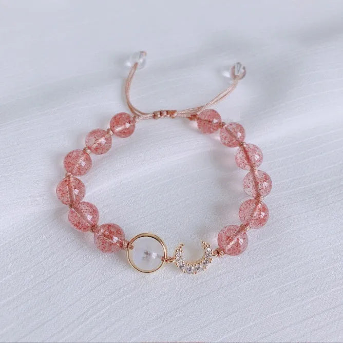 Handmade natural crystal bracelet with strawberry quartz decorative elements in pearl, moon, XINGX, or green design options