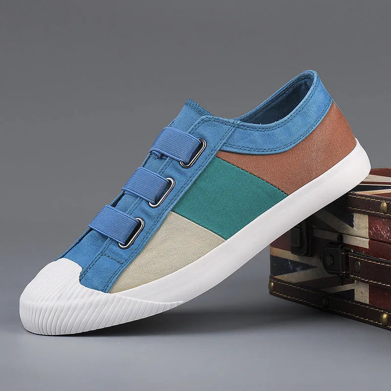 Men's beige canvas low-top sneakers with elastic band fastening and a vulcanised rubber sole.