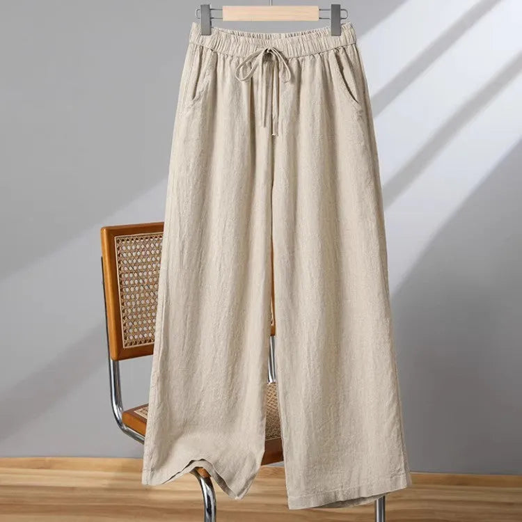 Women's straight-leg casual trousers in apricot colour with elastic and lace-up drawstring waistband.
