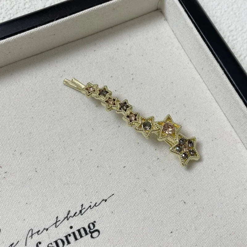 Gold rhinestone barrette with star charms for bangs and broken hairstyles