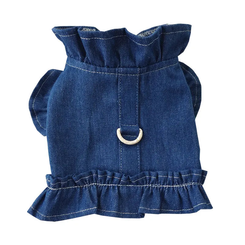 Blue denim pet dress with ruffle trim and leash hook attachments on chest and back