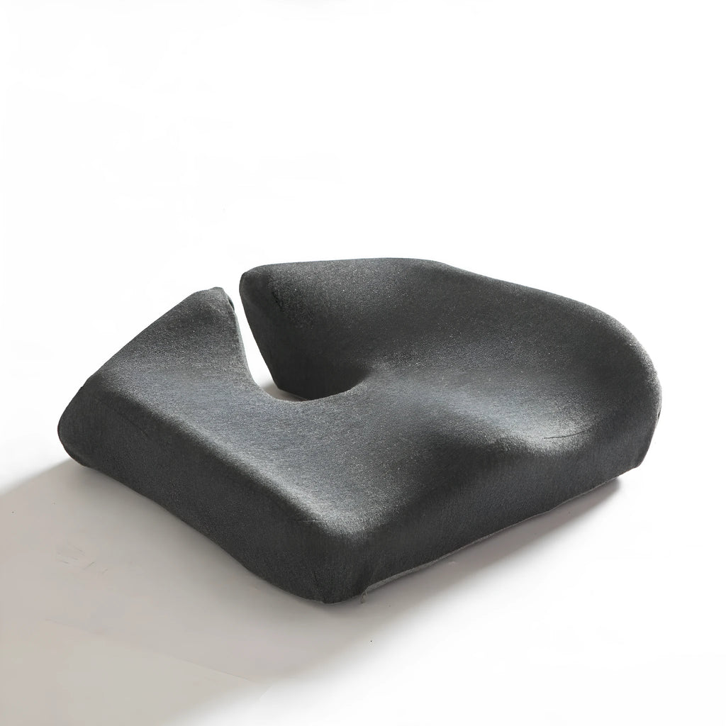 A solid grey memory foam office chair cushion for lumbar support.