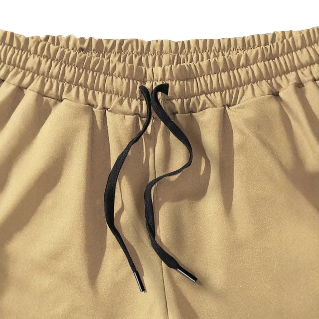 Men's khaki coconut print sports shorts with straight cut design and micro elastic polyester fabric