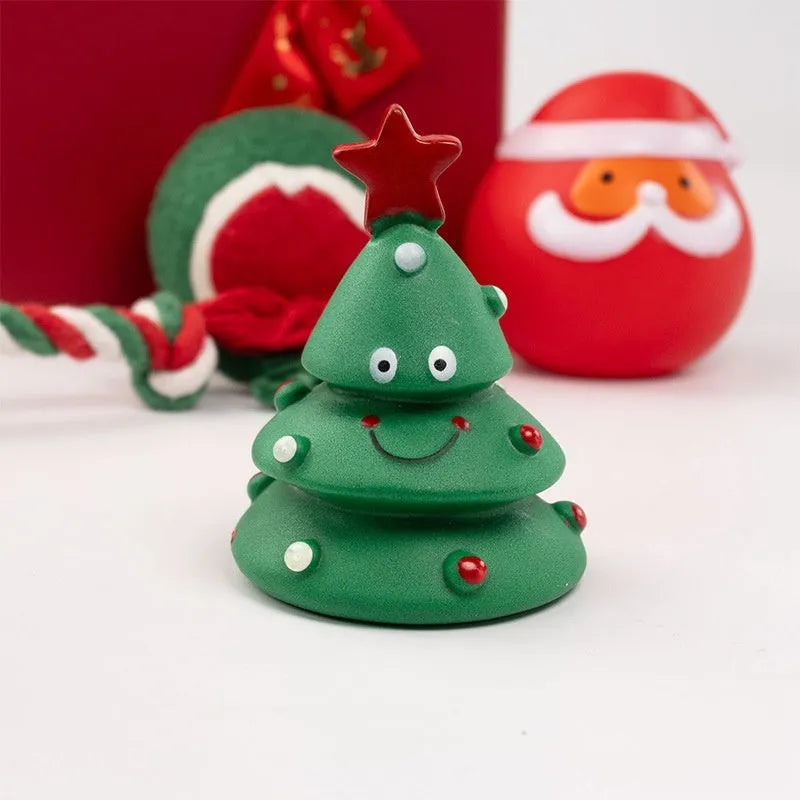 Set of colourful Christmas-themed vinyl dog chew toys including balls, ropes, and Santa figures.
