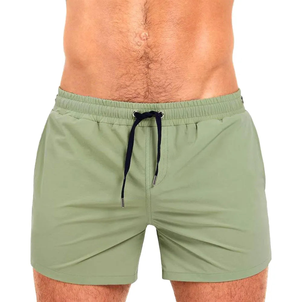Men's solid colour mesh lining sports shorts for swimming and fitness in polyester fabric