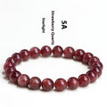 A bracelet made of geometrically cut, pink strawberry quartz beads in three size options.