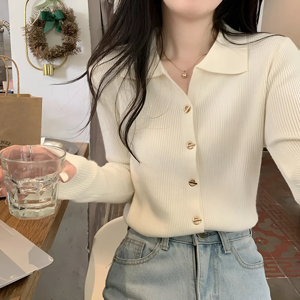 Beige loose fit long-sleeved viscose knitted cardigan top worn open as a layer.