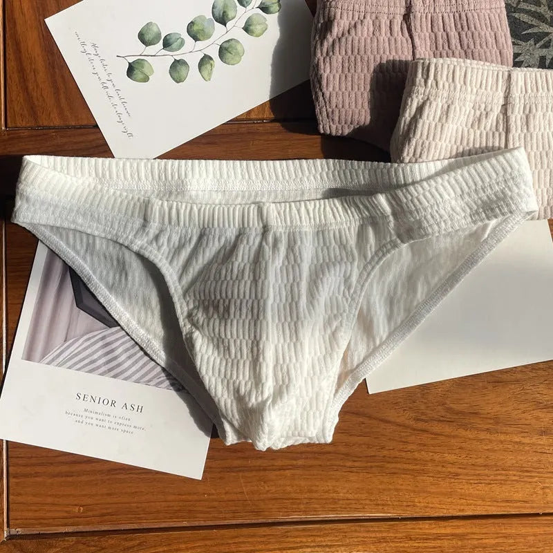 Men's solid colour cotton triangle underwear briefs in mid-waist design on a white background