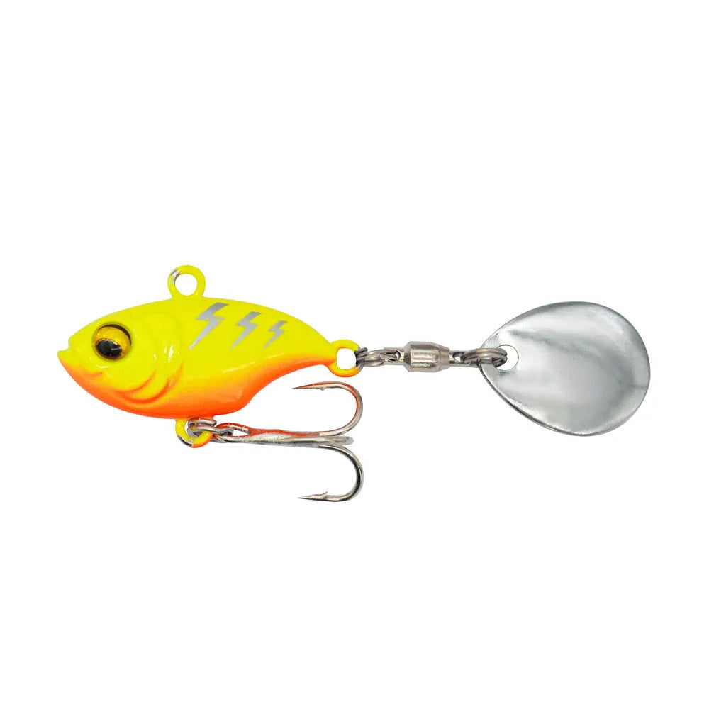 Metal sea fishing lure with rotating sequins in gold colour pattern