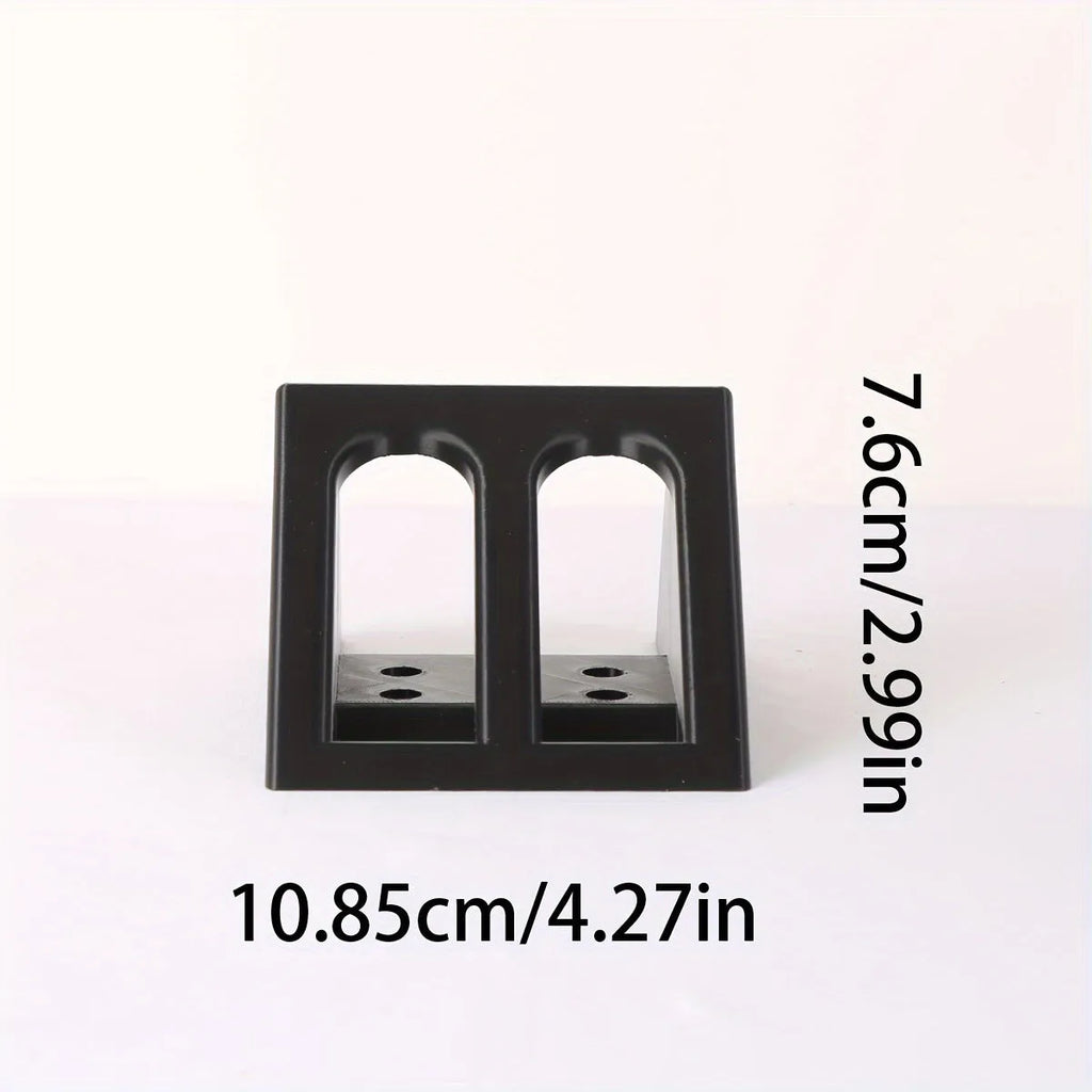 Black punk-style plastic pistol display stand measuring 10.85cm by 7.6cm