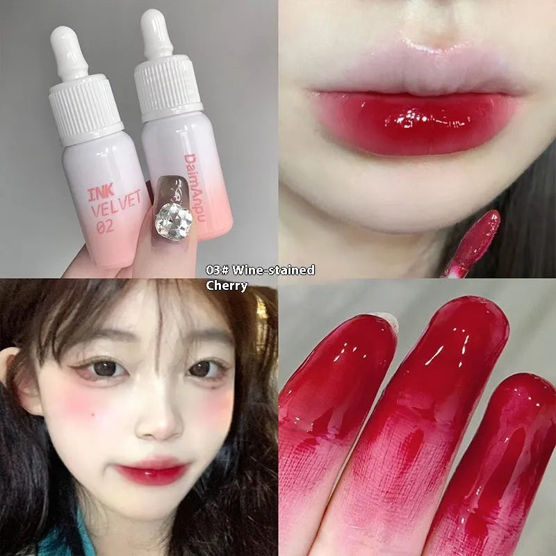 Mirror Lip Lacquer lip gloss tube in one of four shades: Spring Day Wilderness, Orange Tabby Cat Diary, Low-key Charming, or Misty Berry.
