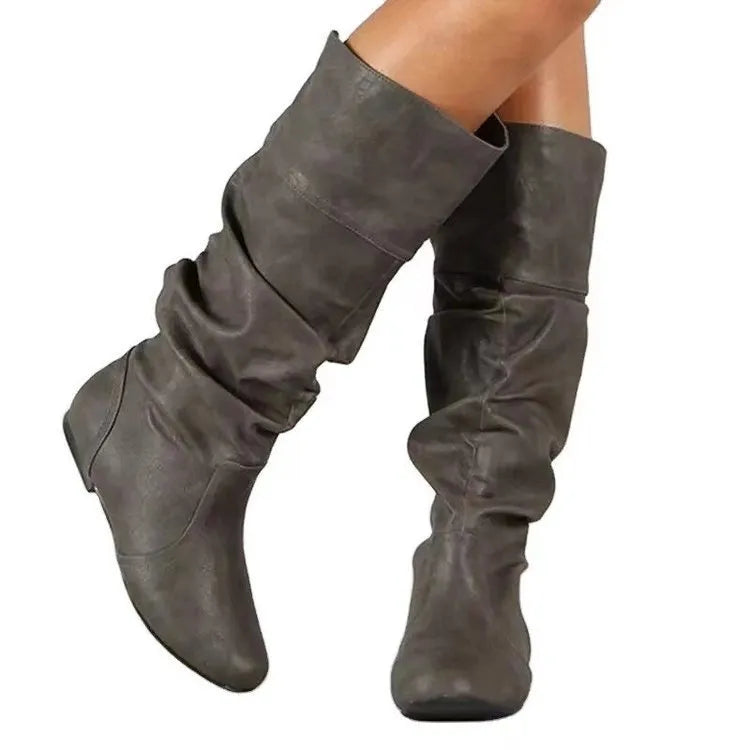 Women's slip-on flat ankle boots in artificial PU leather with high shaft and rubber sole