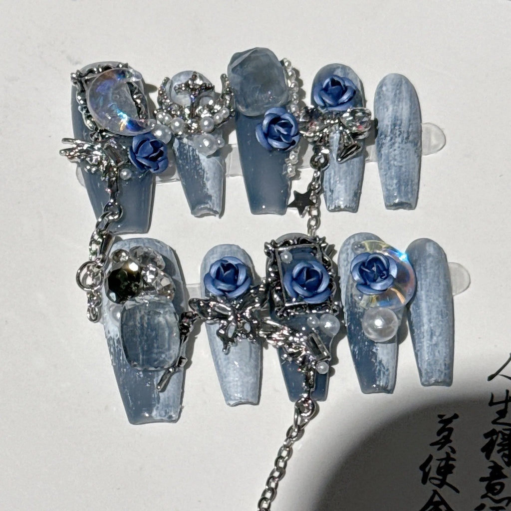 Wearable plastic nail armour suit in heavy industry night blue with ornate rose and tulip floral pattern.