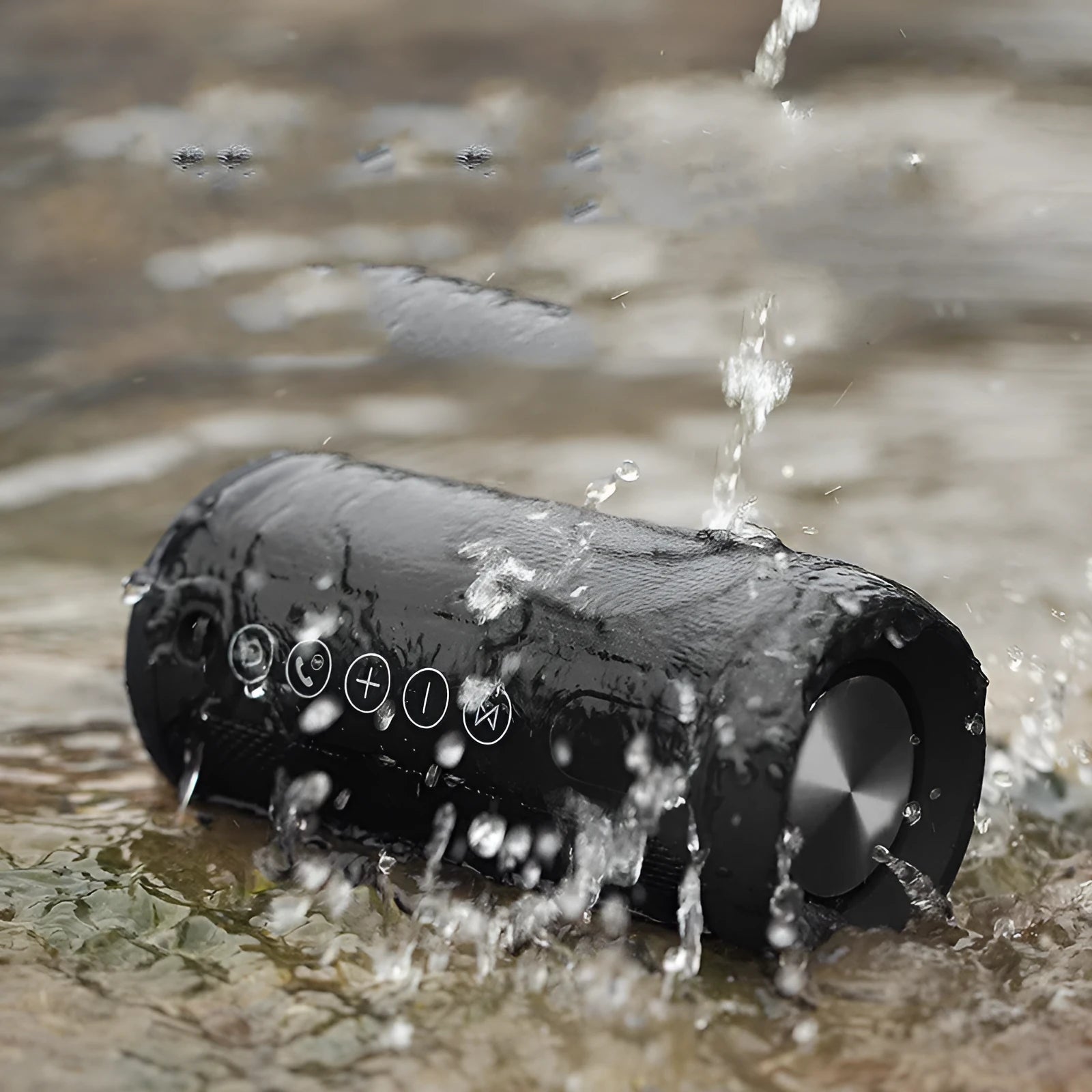 Black waterproof portable outdoor Bluetooth speaker with control buttons on top.