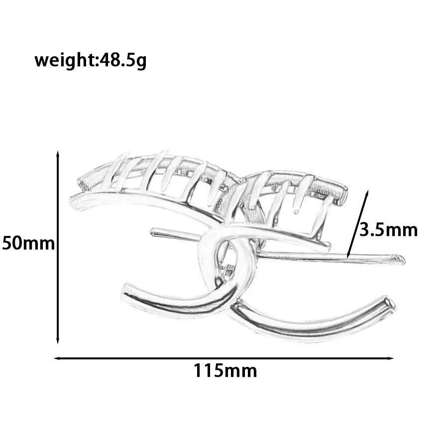 Silver metal hair claw clip assortment showing bows, waves, pearl designs, and geometric shapes from 4cm to 13.5cm
