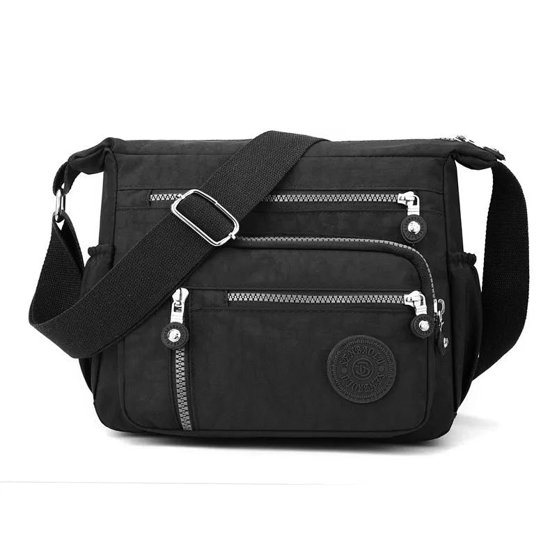 Nylon messenger bag in square vertical shape with single shoulder strap, shown in one of five colour options