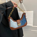 Brown denim women's shoulder bag with diamond mesh panel and chain strap showing bucket shape