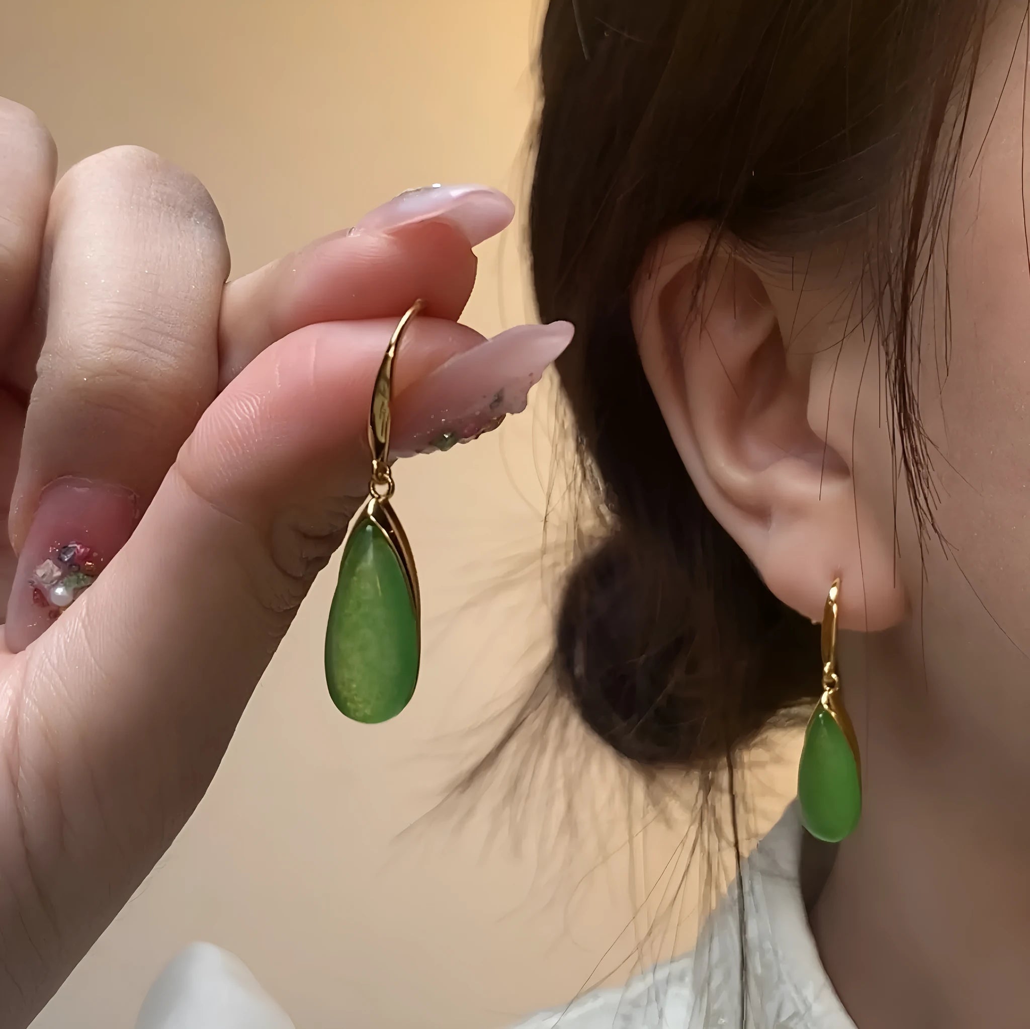Geometric copper earrings with jade-colour water droplet elements in Chinese banquet style