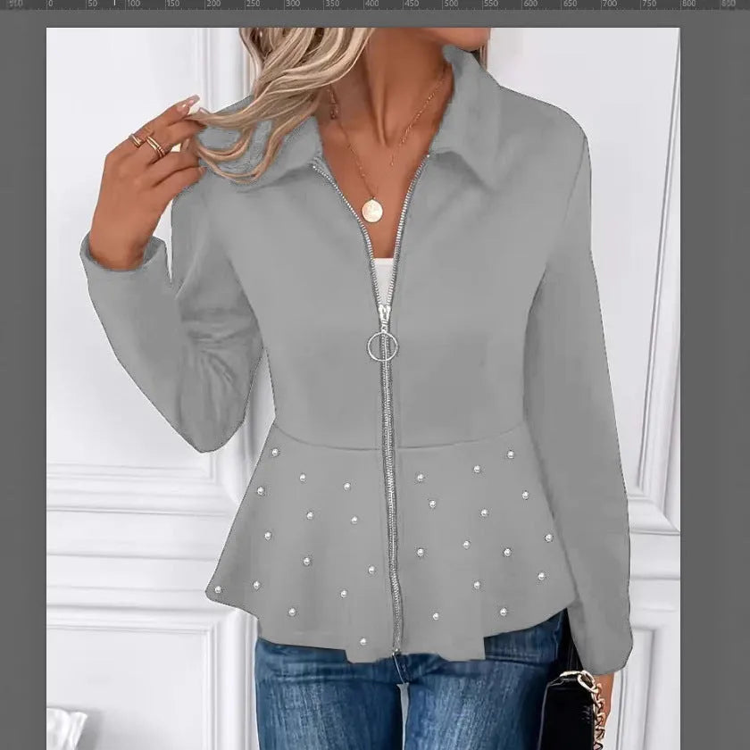Women's loose black coat with beaded zipper and ruffled hem, shown on a hanger.