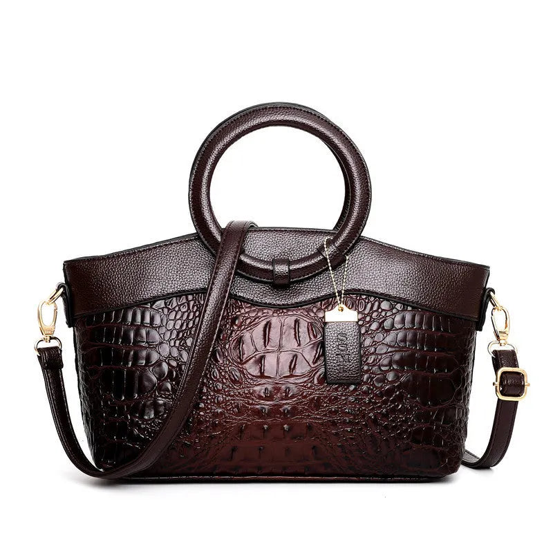 Fashion handbag in fabric with shoulder strap, showing internal phone and card compartments
