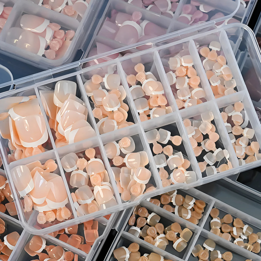120 piece box of French white edge toenail pieces in nine nude colours with full square short shape