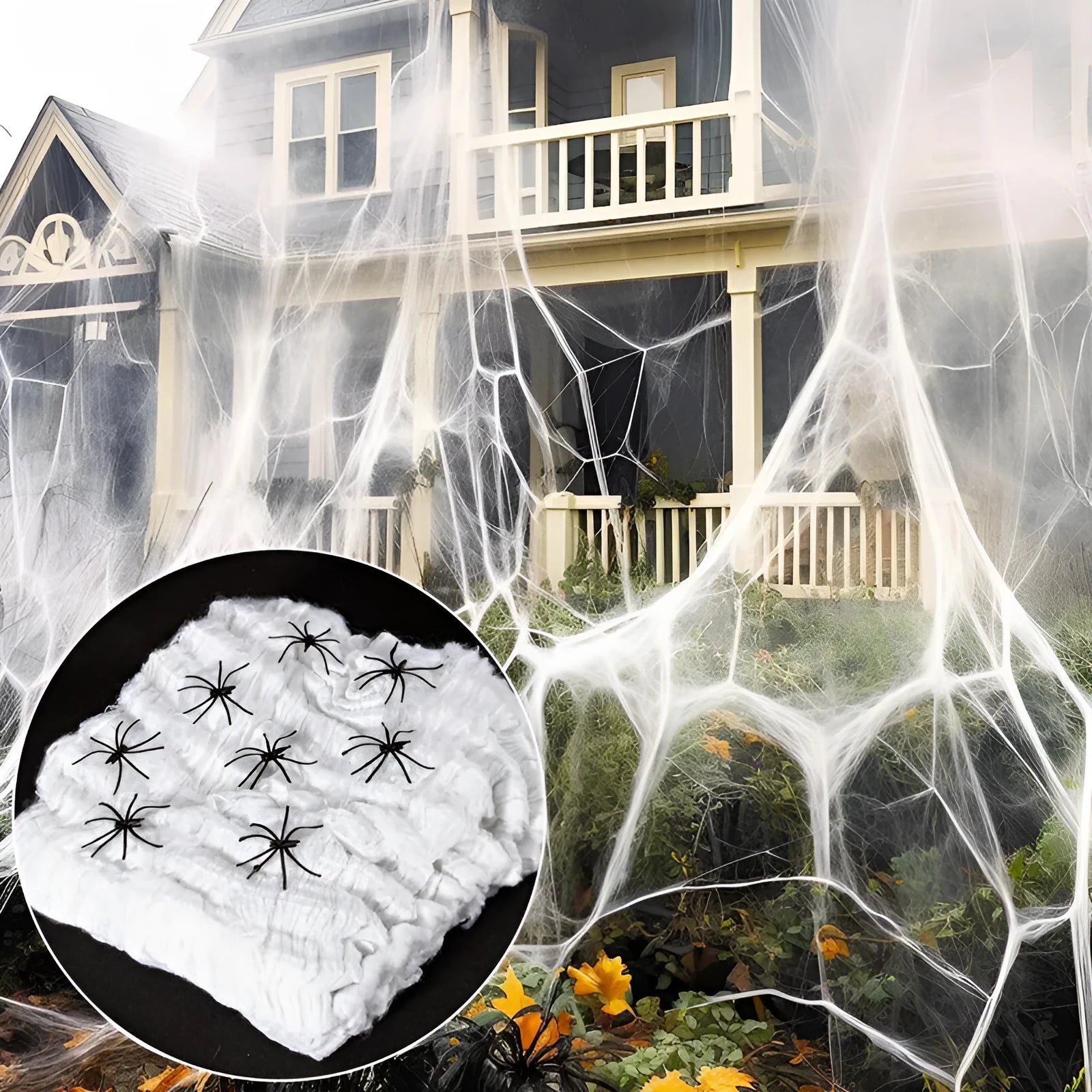 White cotton spider web Halloween decoration with multiple attached spiders draped over a surface.
