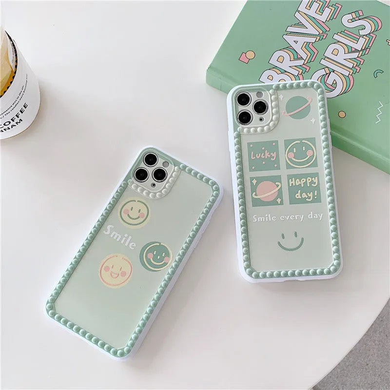 Green TPU iPhone case with smiley face pattern and polka dot frame geometric design