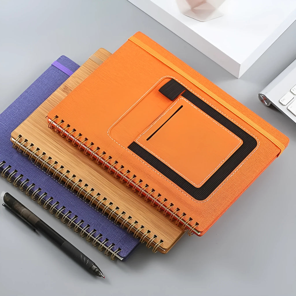 Erasable coil notebook with waterproof stone paper and erasable pen on desk