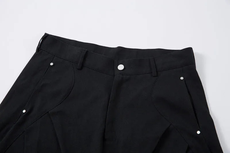 Men's black pleated casual trousers with machete pleats and loose wide-leg fit