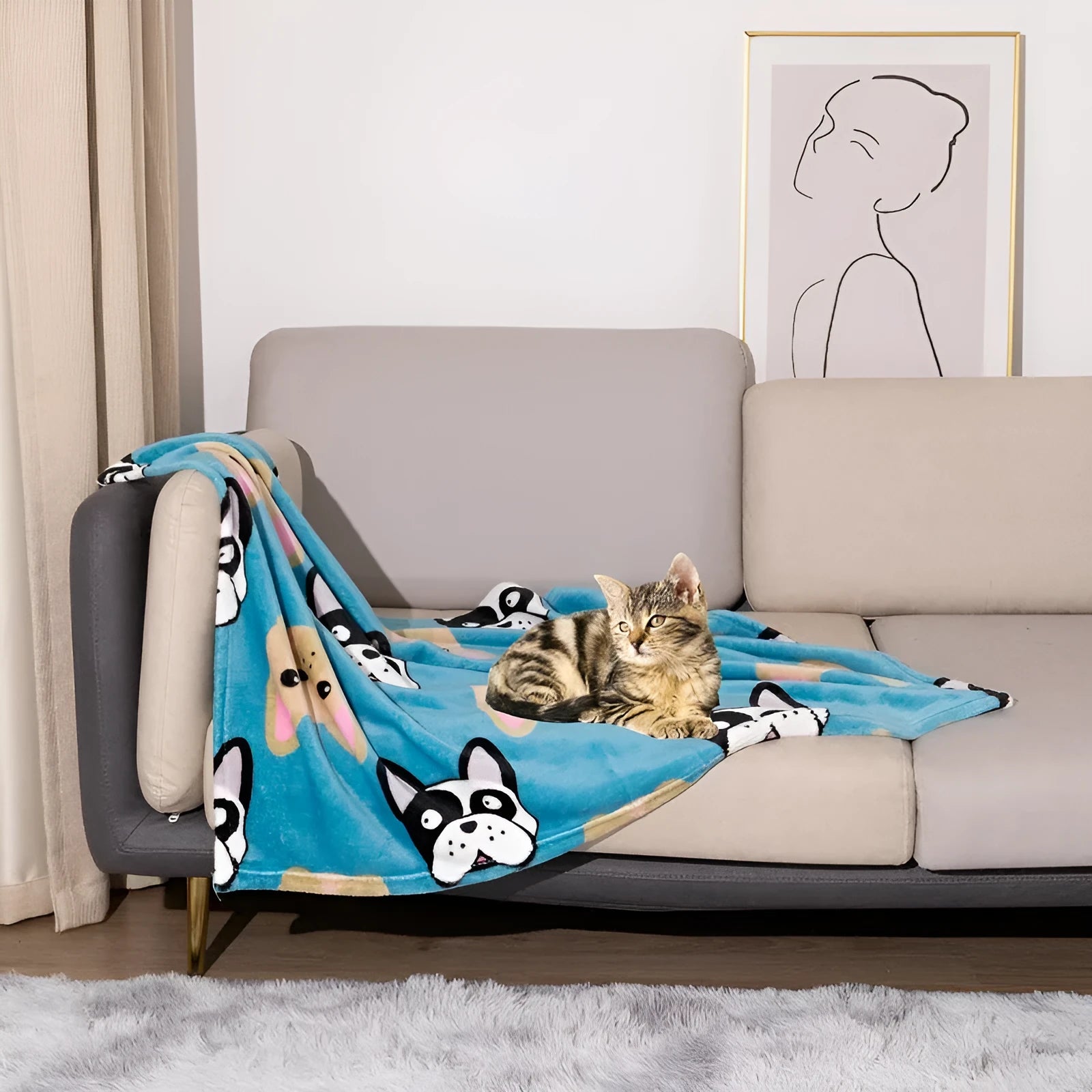 Blue cartoon dog paw patterned flannel pet blanket laid flat, showing its size.