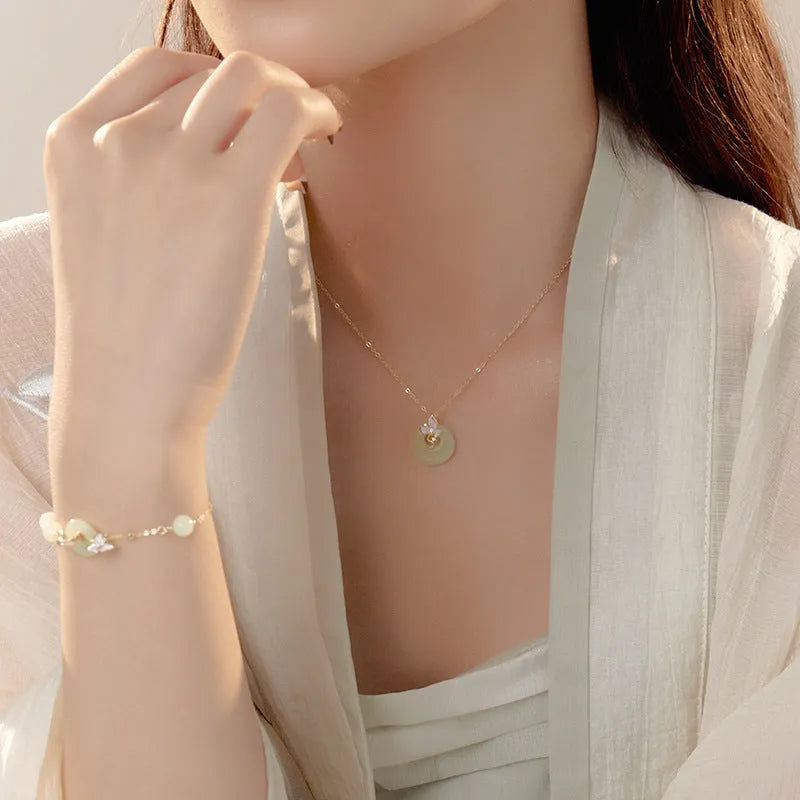 Silver orchid necklace with peace buckle clasp and floral pendant on O-ring chain