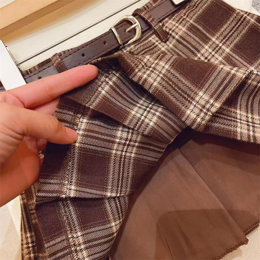 Girls' plaid pleated A-line skirt made from cotton blend fabric with a full lining.