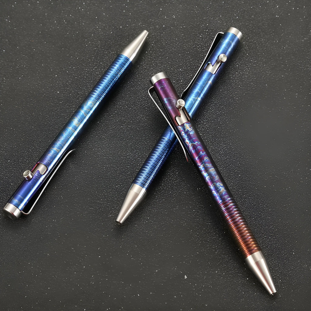 Titanium alloy ballpoint pen with gun bolt handle mechanism showing phantom colour finish variations