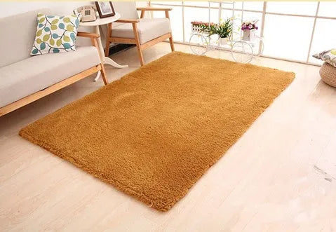 Solid colour fluffy plush rectangle carpet showing soft pile and non-slip dotted bottom.