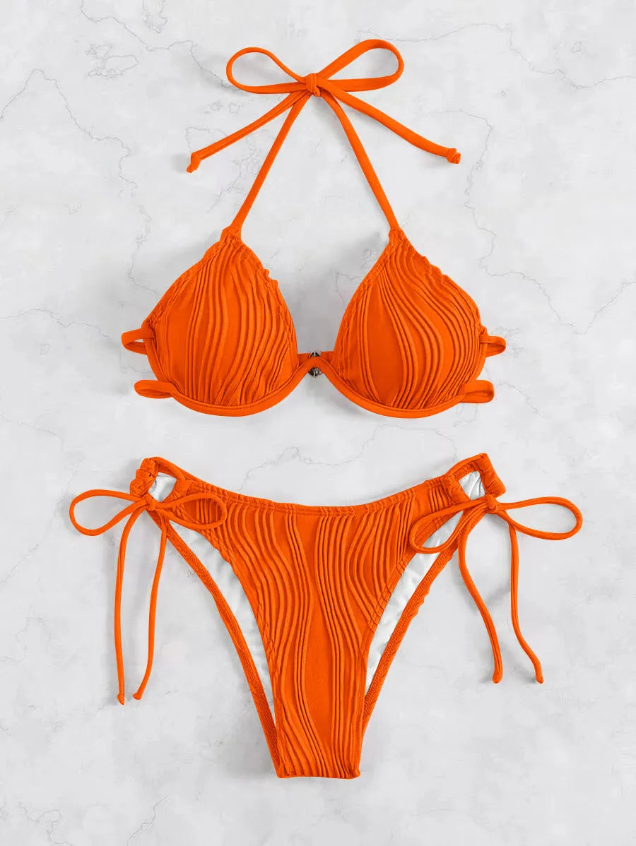 Women's apricot coloured split bikini swimsuit with steel wire bracket support.