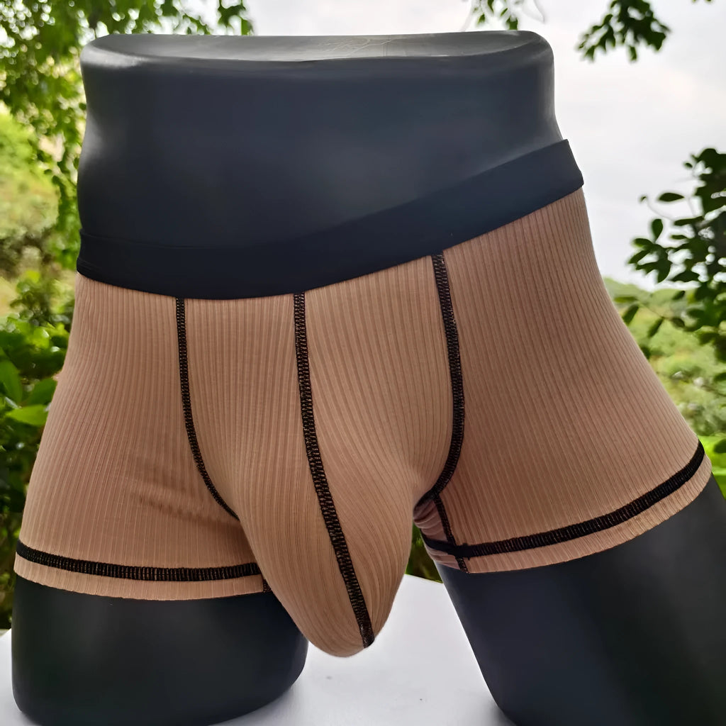 Men's solid colour boxers in breathable fibre fabric showing hip-lifting design